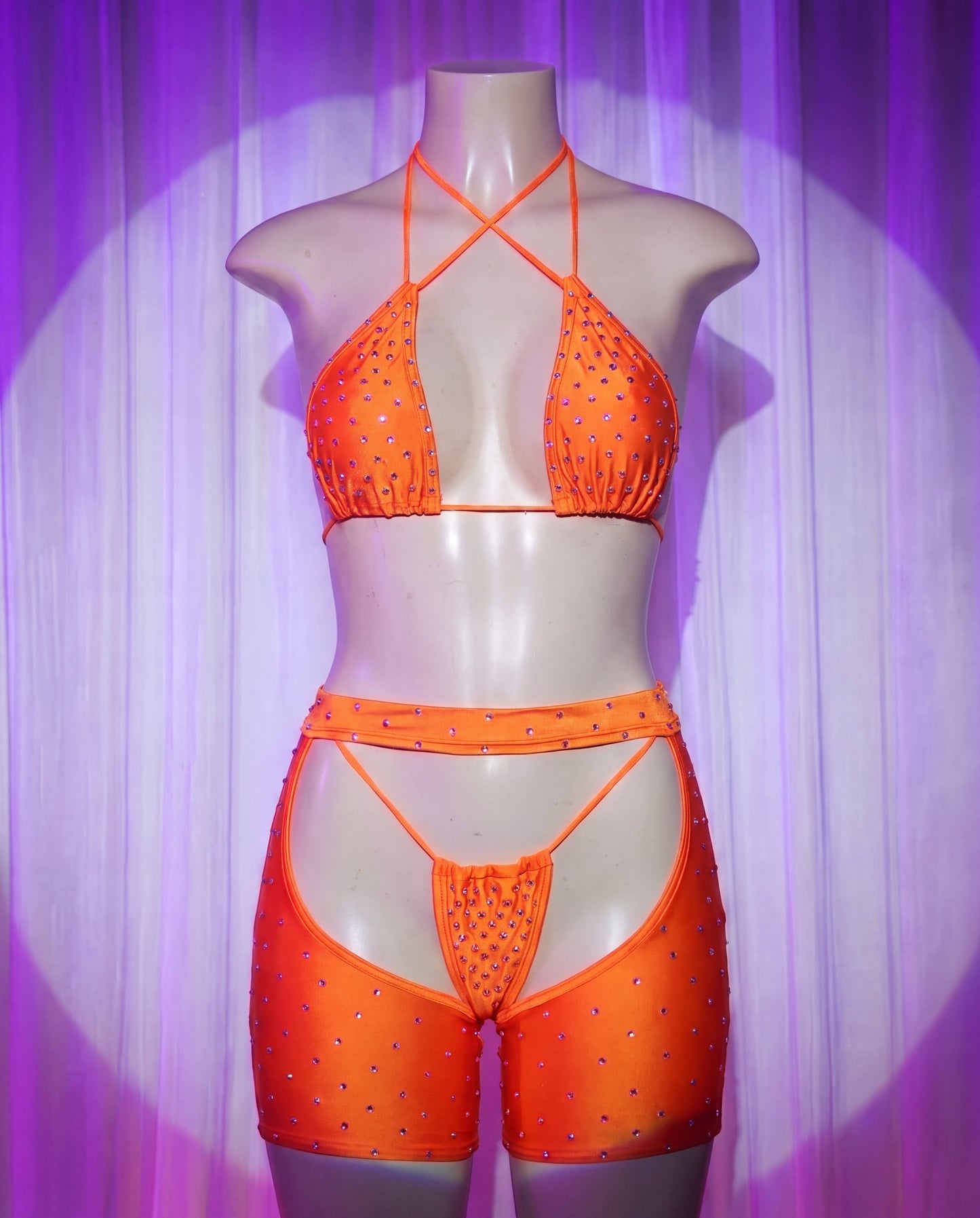 Front view of Rodeo orange rhinestone cowgirl stripper outfit with bikini top, thong and chaps