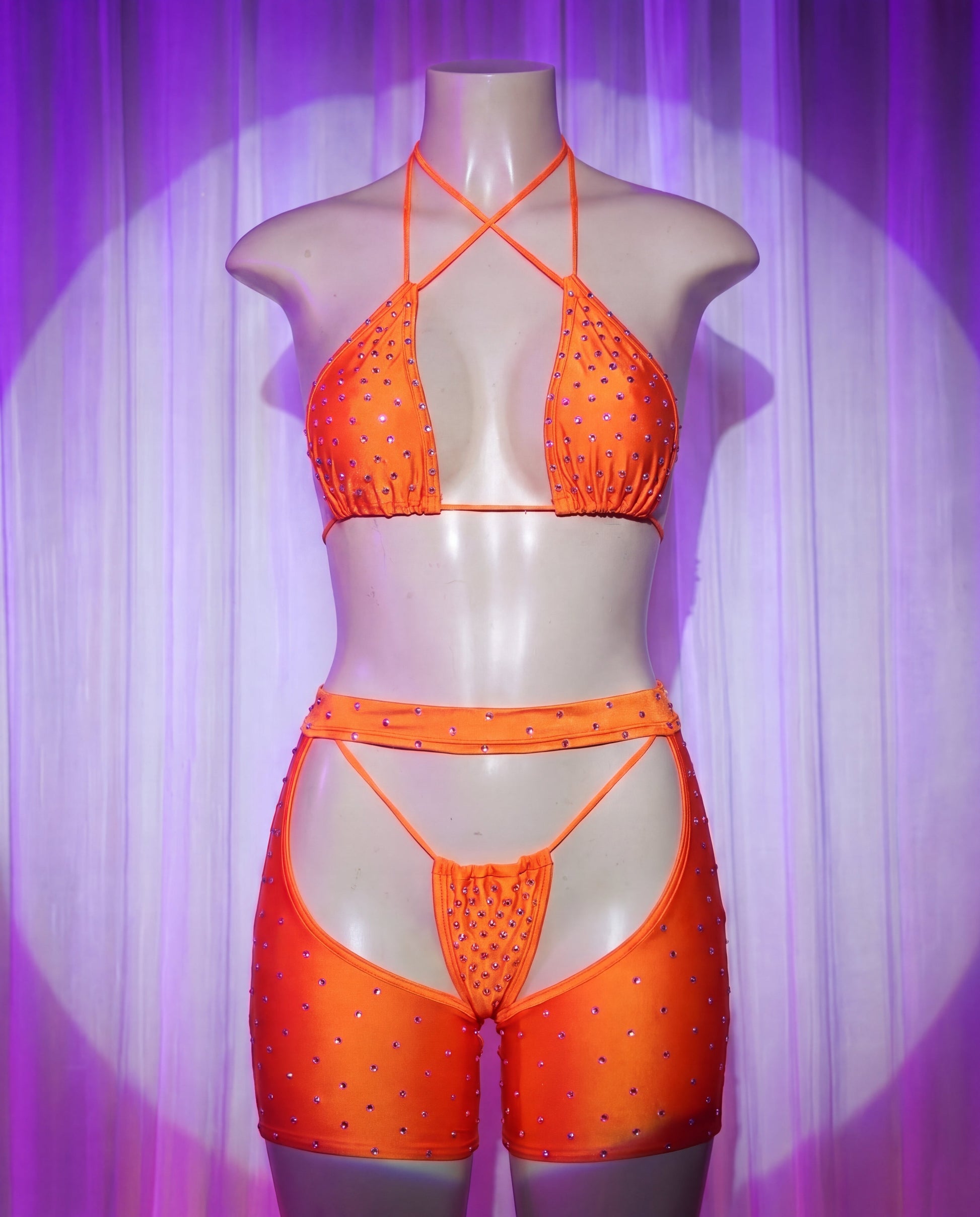 Front view of Rodeo orange rhinestone cowgirl stripper outfit with bikini top, thong and chaps