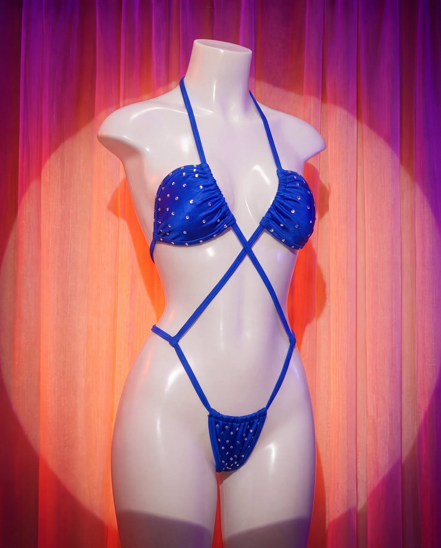 Side view of Deep Trouble blue rhinestone crisscross one-piece stripper outfit