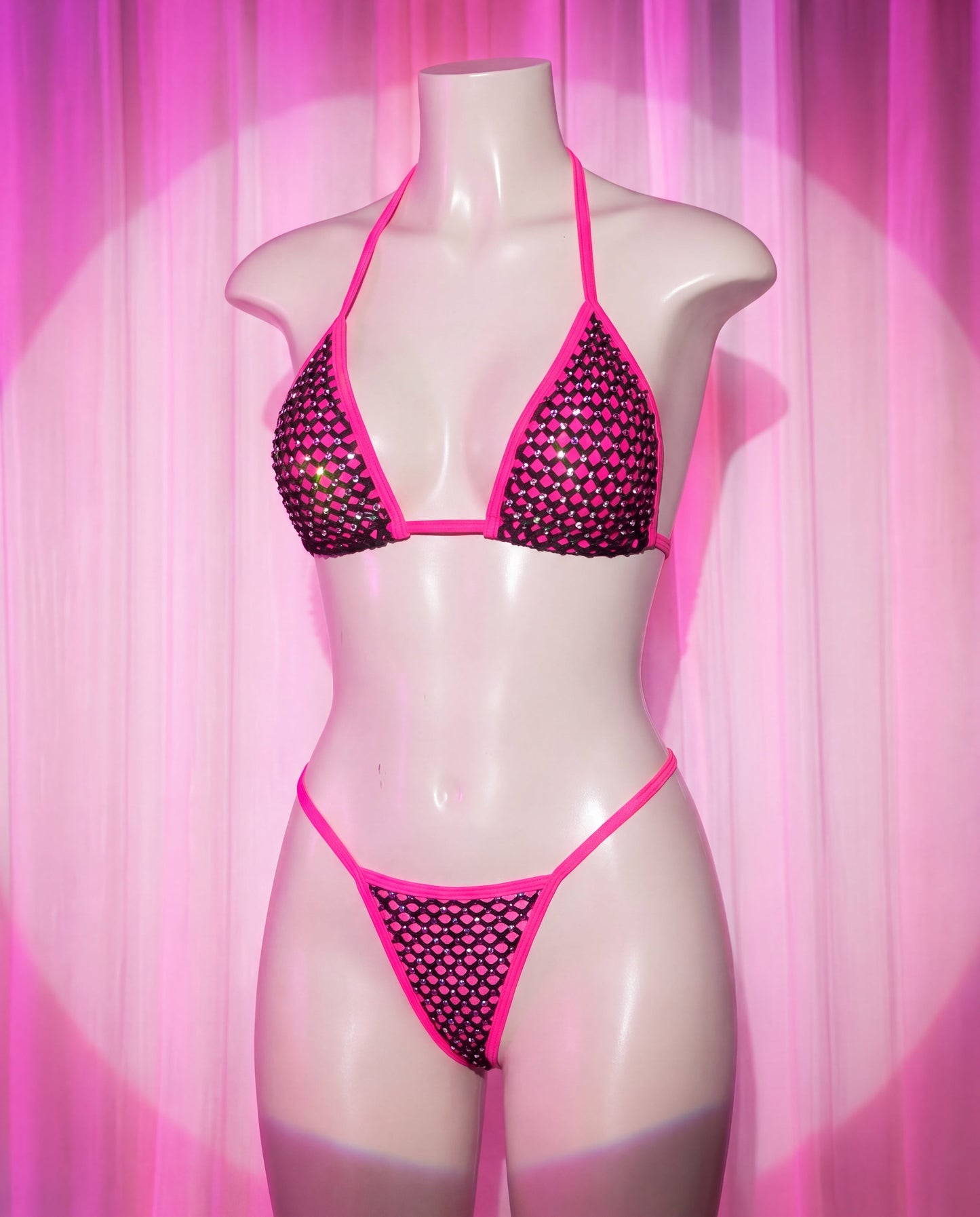 Side view of Rebel pink and black fishnet rhinestone stripper bikini set