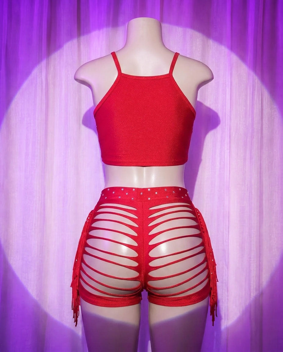 Back view of Diabla red rhinestone stripper shorts set with slashed shorts and side fringe
